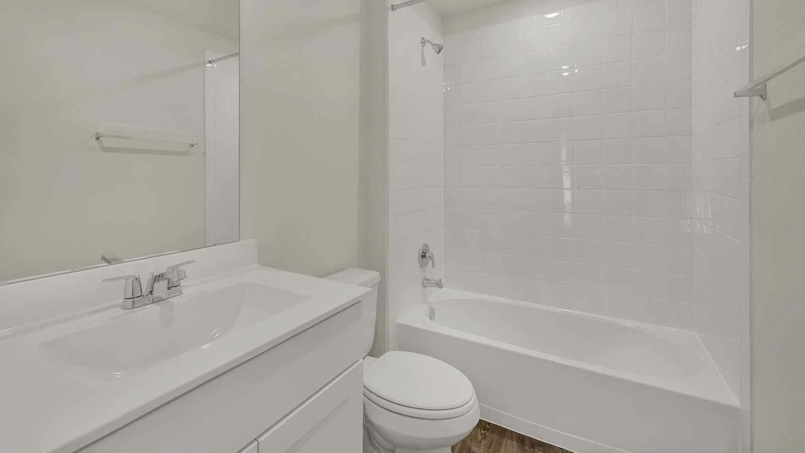 Owner’s ensuite bathroom featuring a walk-in shower and built-in storage shelving.