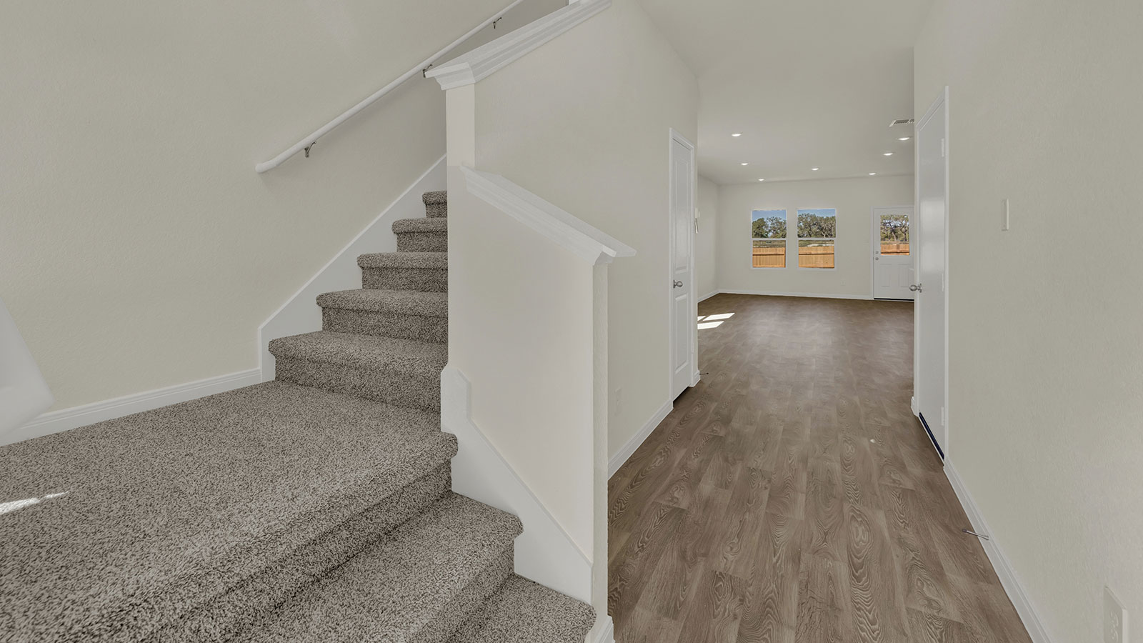Kitchen view showcasing functional layout with cabinetry, prep zones, and connection to dining and living areas.