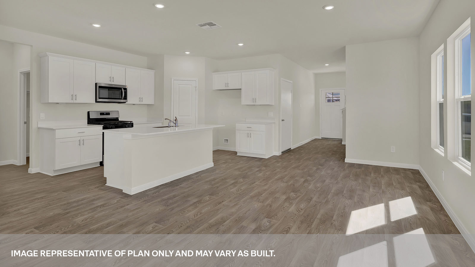 Kitchen with kitchen island and dining room.