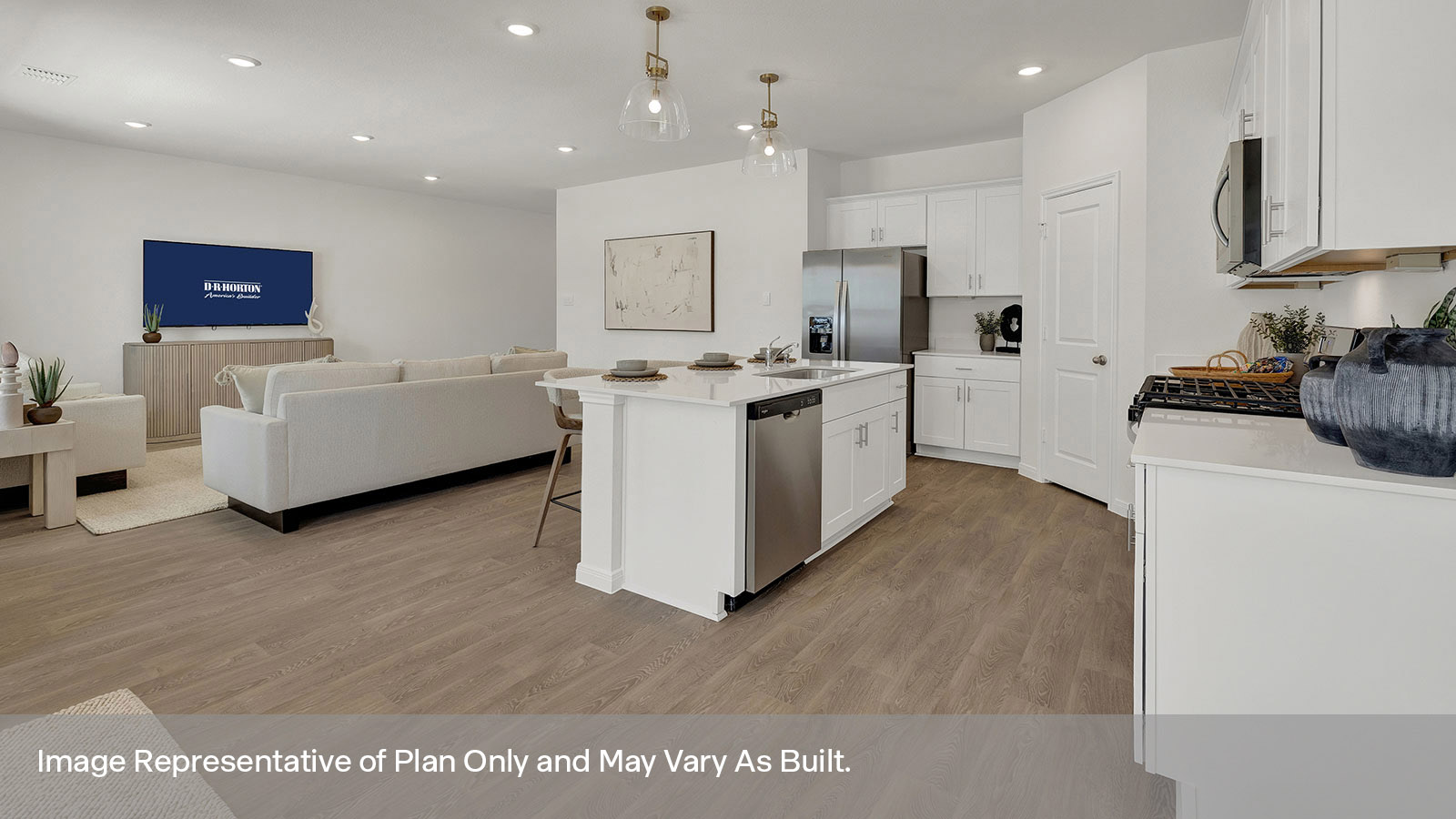 Kitchen with kitchen island and stainless steel appliances.