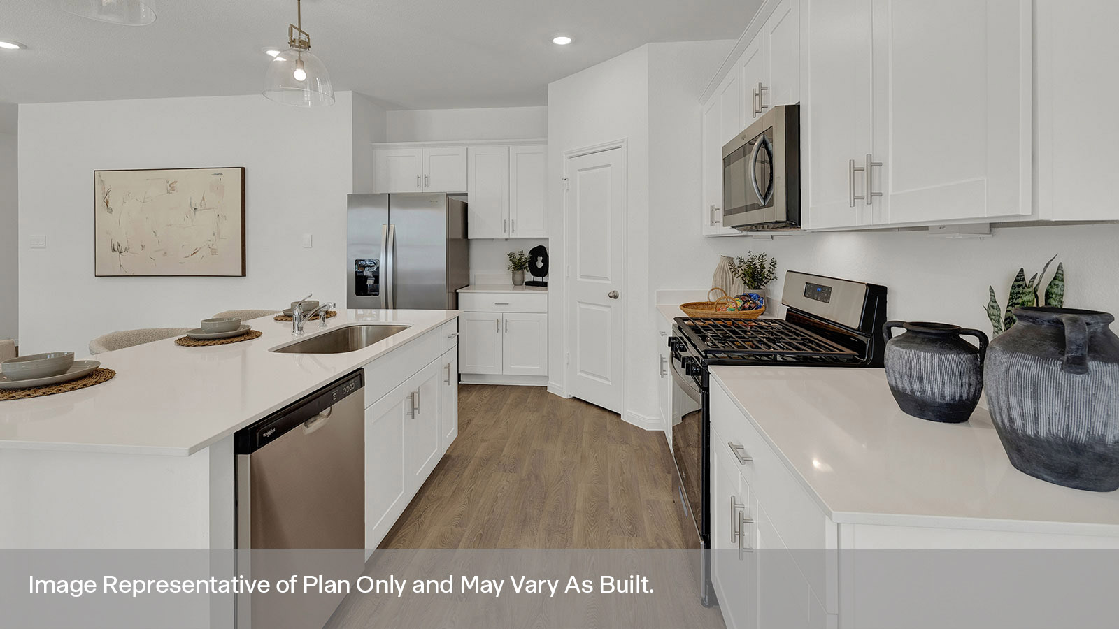 Kitchen with kitchen island and whitecabinets.