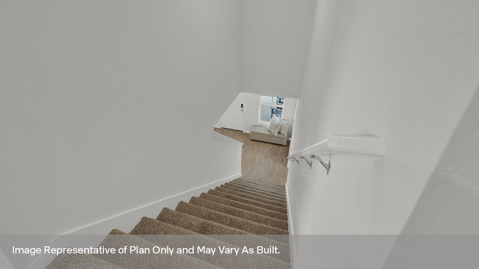 Gameroom of off the staircase with carpeting and two windows.