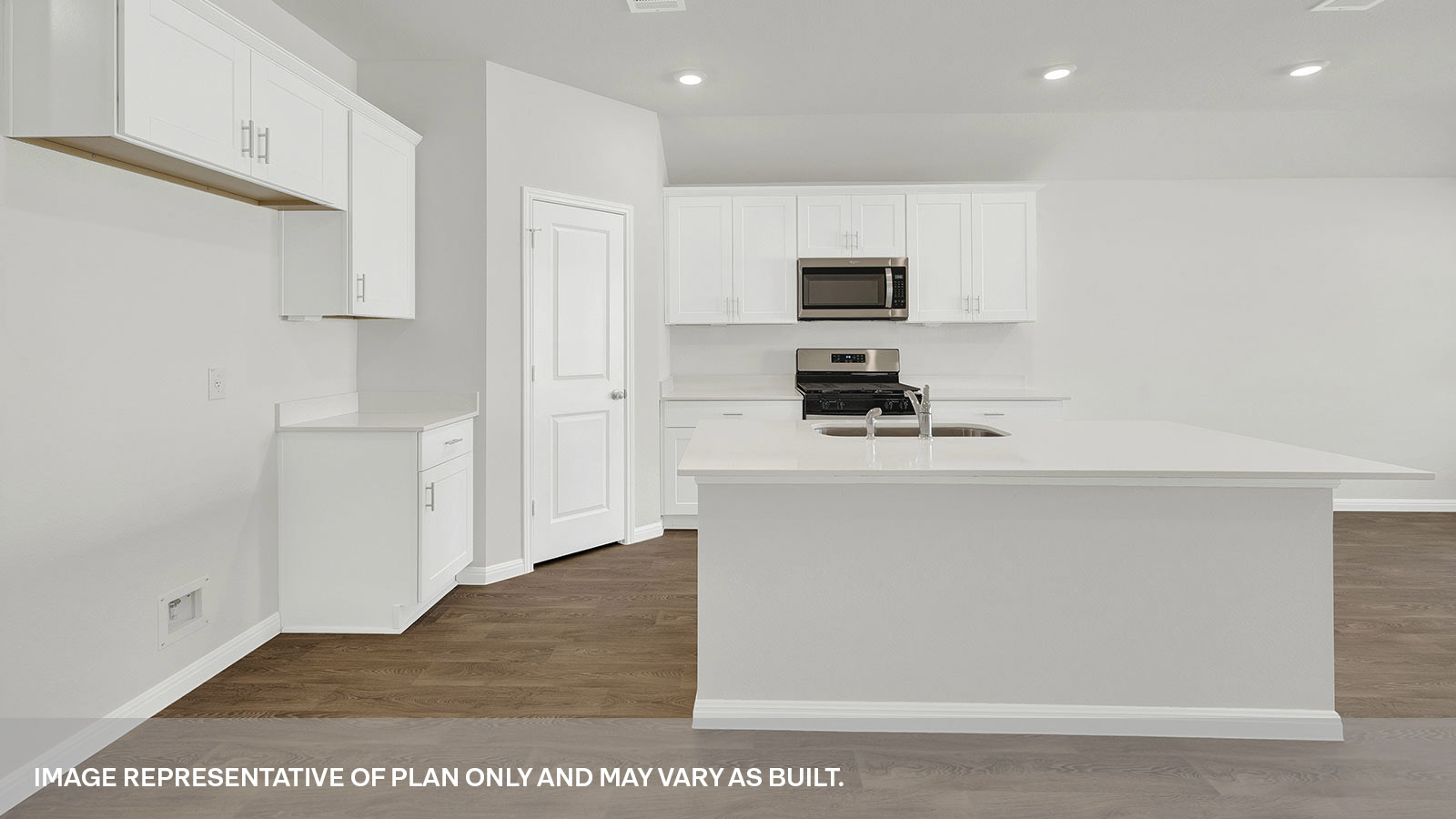 Kitchen with kitchen island and granite countertops.