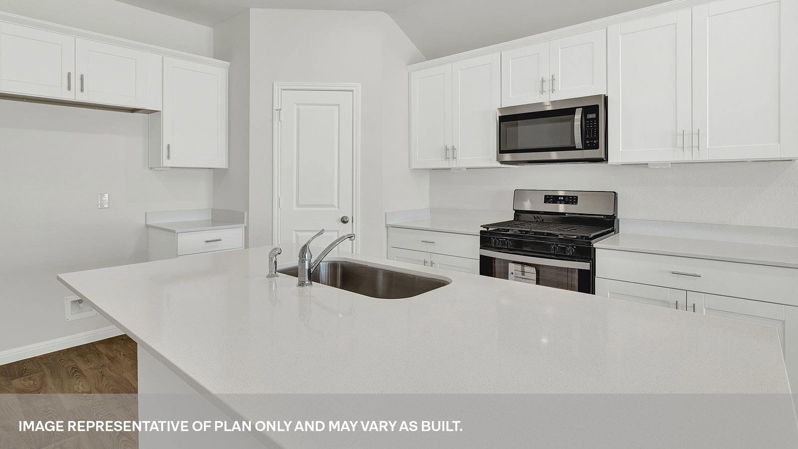 Kitchen with kitchen island and granite countertops.