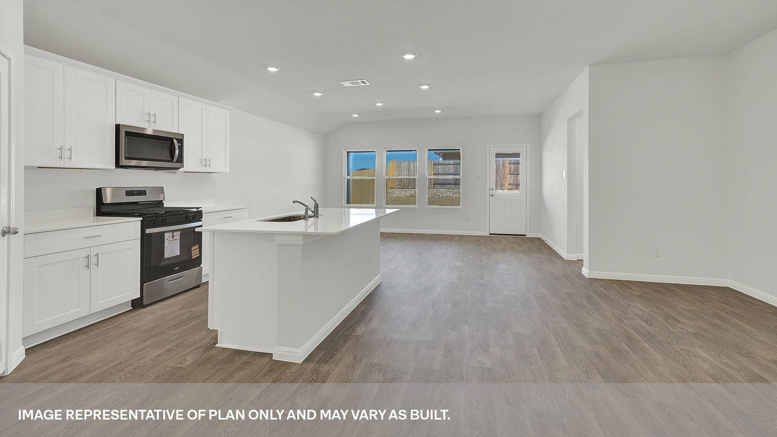 Kitchen with kitchen island overlooking the living room.