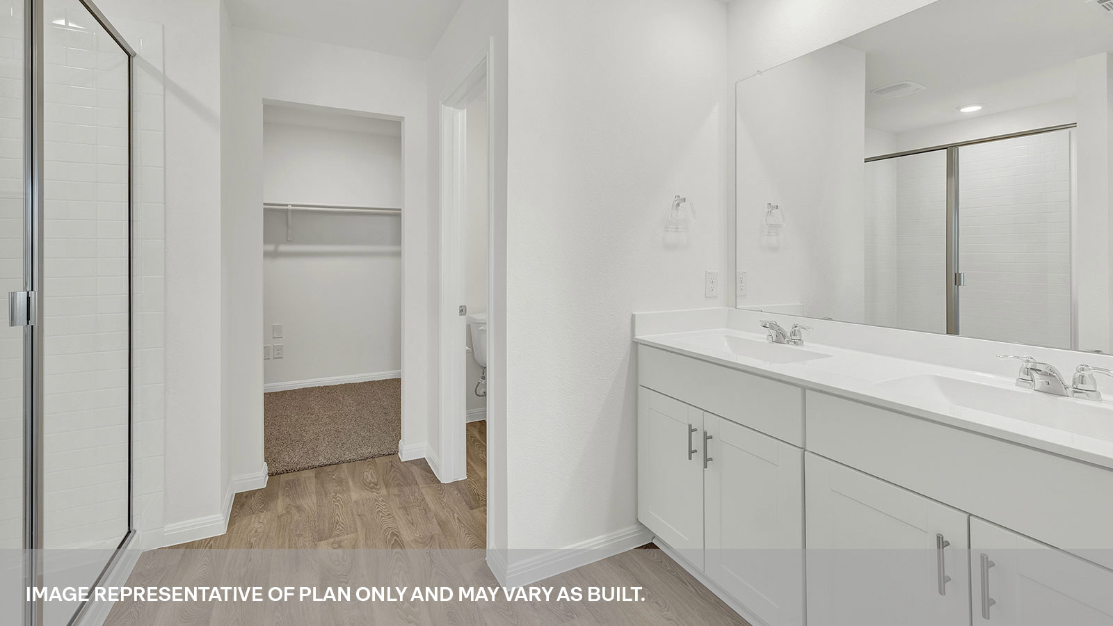 Main bathroom with double sink vanity and looking into the bedroom.