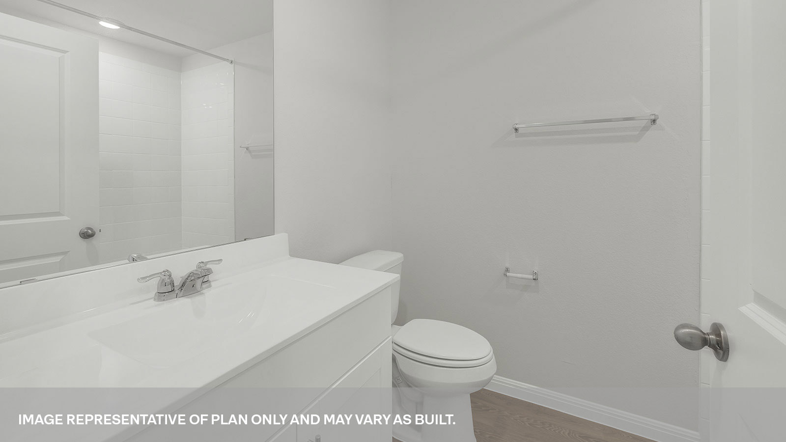 Hall bathroom with single sink vanity and toilet.