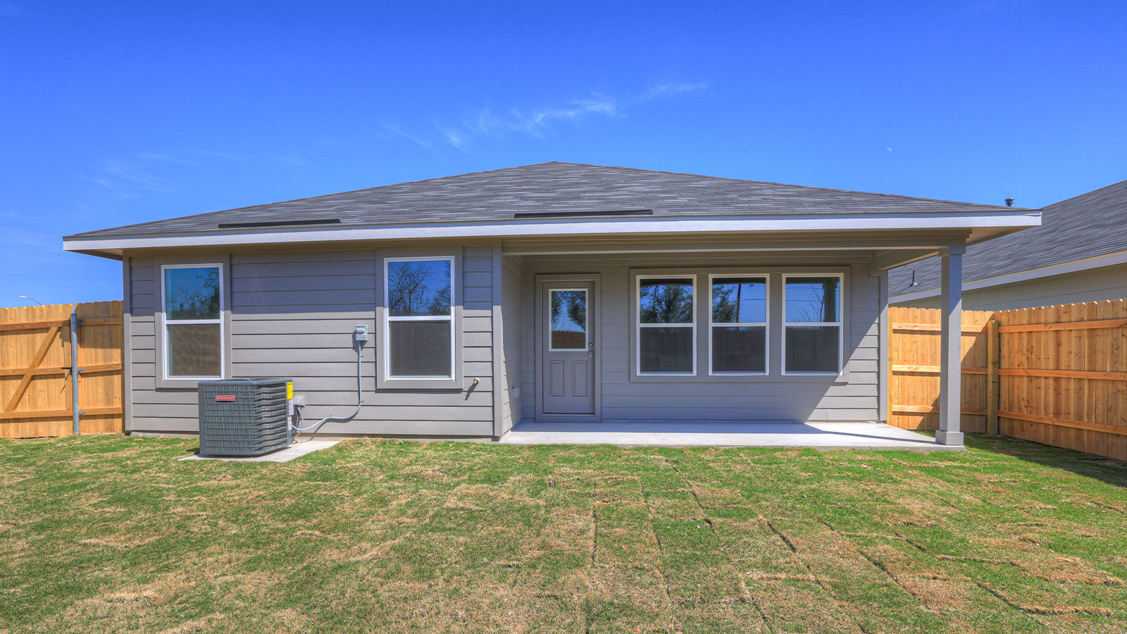 Covered patio overlookin the backyard.