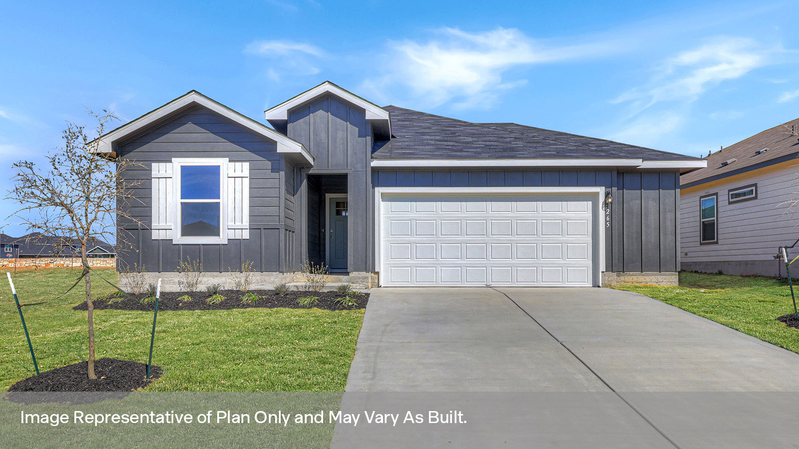 Single-story farmhouse with 2 car garage.