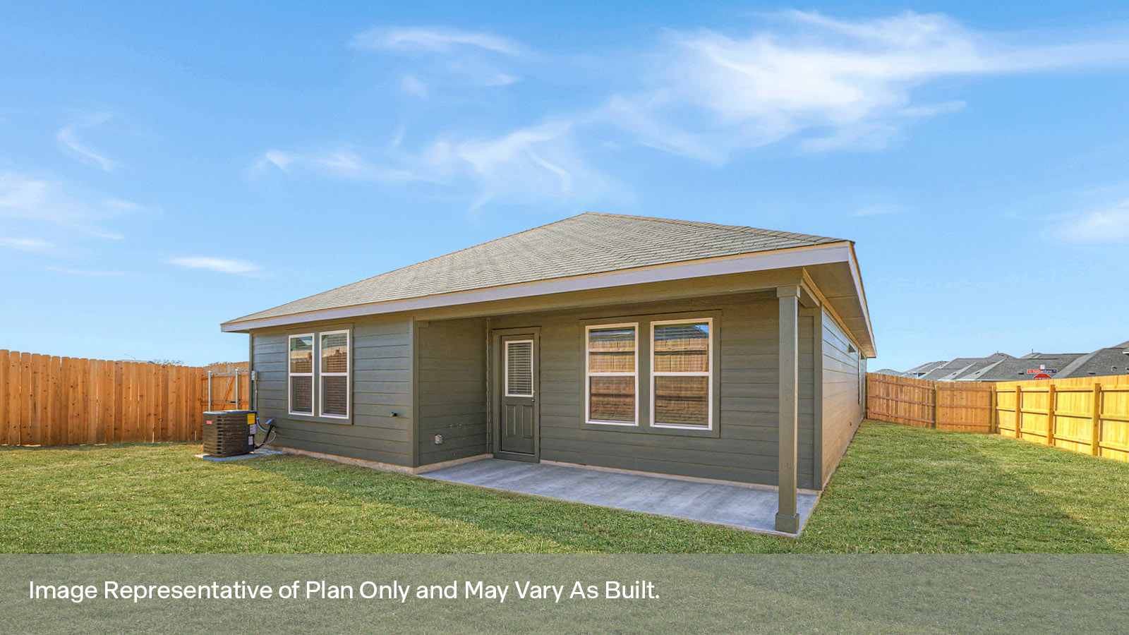.Covered patio with two windows and a half lite exterior door.