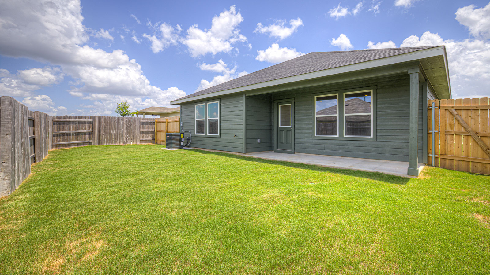 .Single-story farmhouse rendering with farmhouse exteriors, one window, and a 2 car garage.