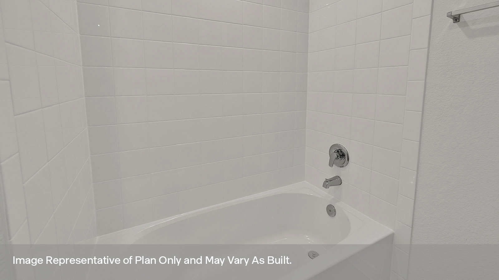 Hall bathroom with tub and tile surround.