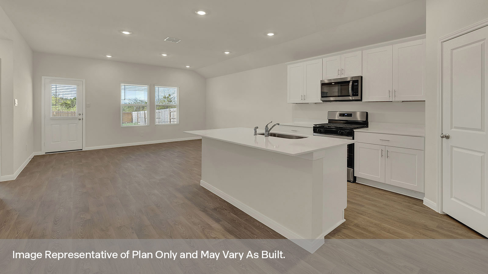 Kitchen and kitchen island overlooking the dining room.