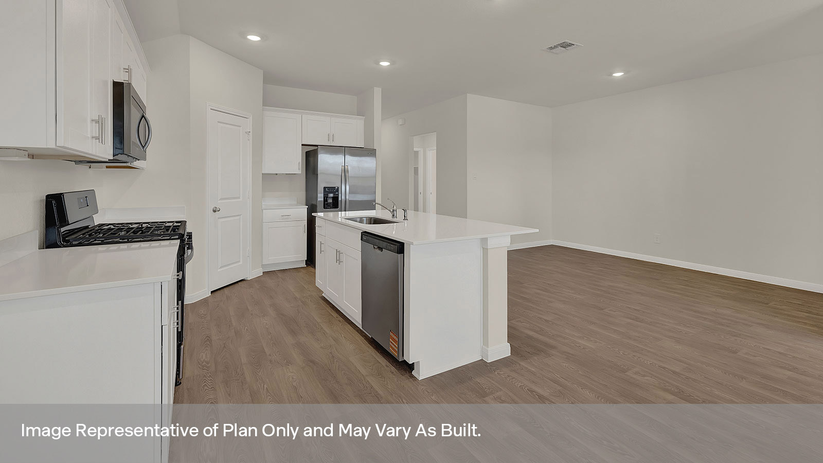 Kitchen and kitchen island overlooking the dining room.