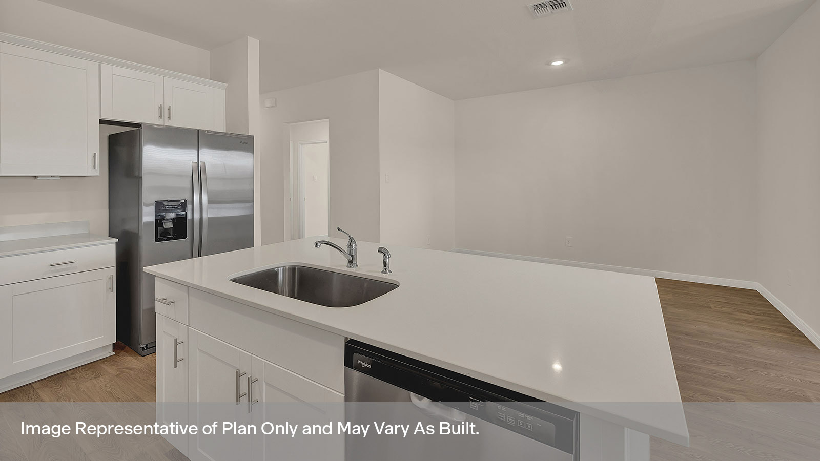 Kitchen and kitchen island overlooking the dining room.