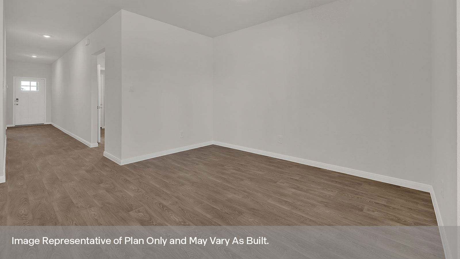 Dining room with vinyl flooring and entry hallway.