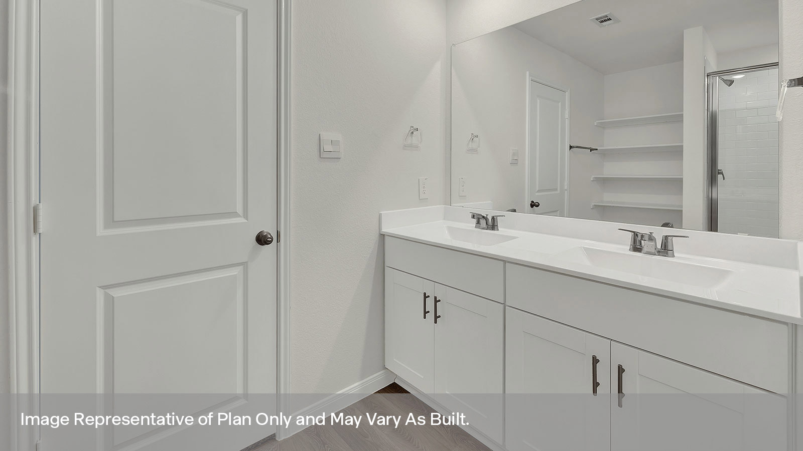 Main bathroom with double sink vanity and closet.