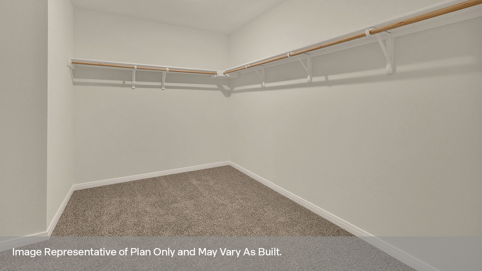 Main bedroom closet with carpeting and wooden shelving.