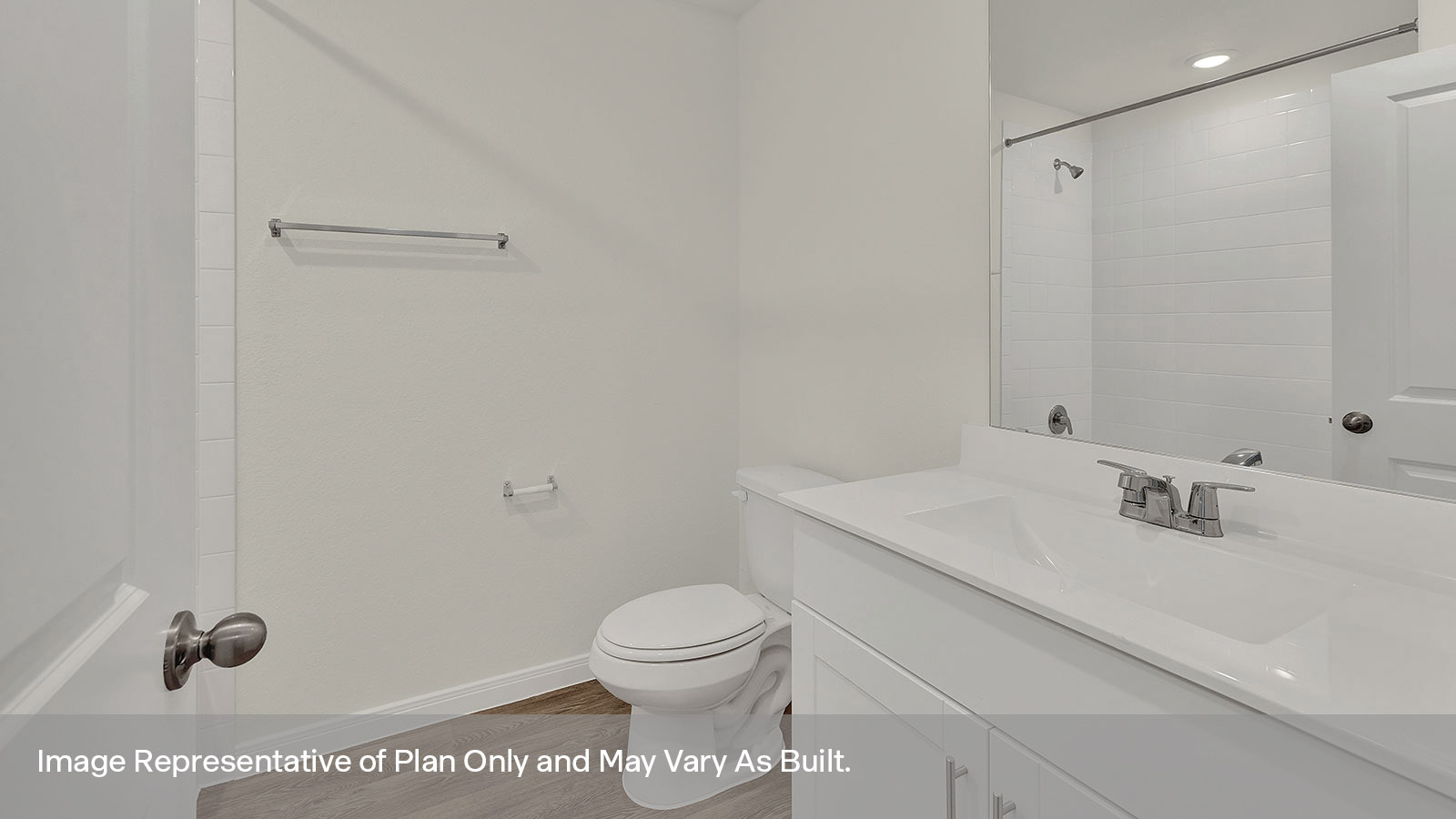 Hall bathroom with single sink vanity and toilet.