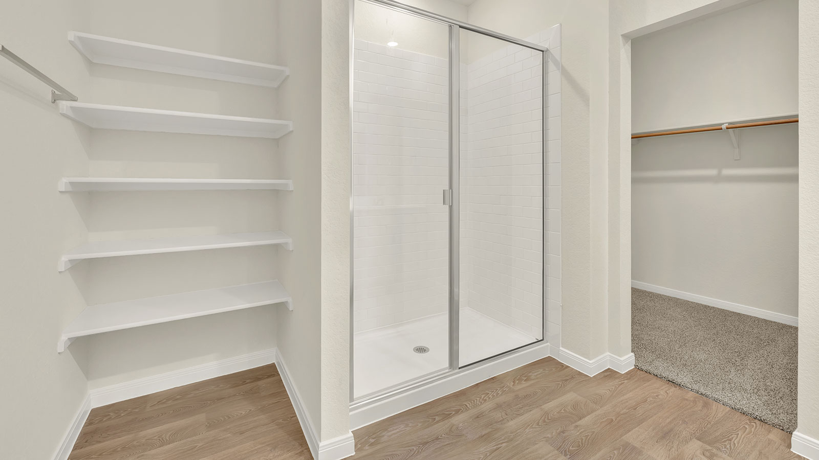 Main bathroom with vanity and wooden shelving.