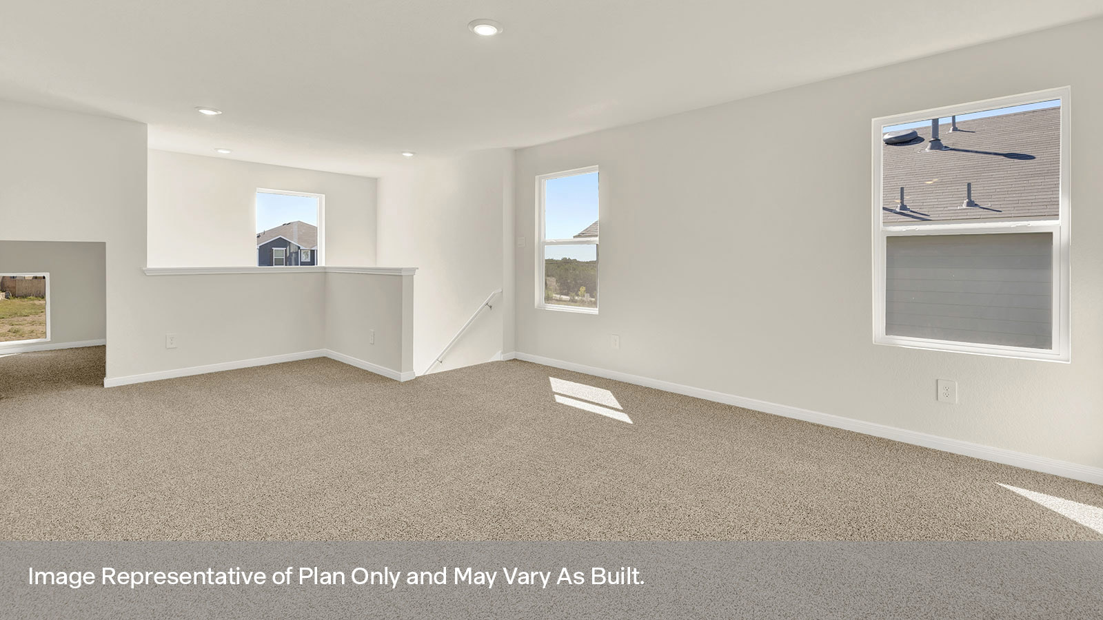 Gameroom of off the staircase with carpeting and two windows.