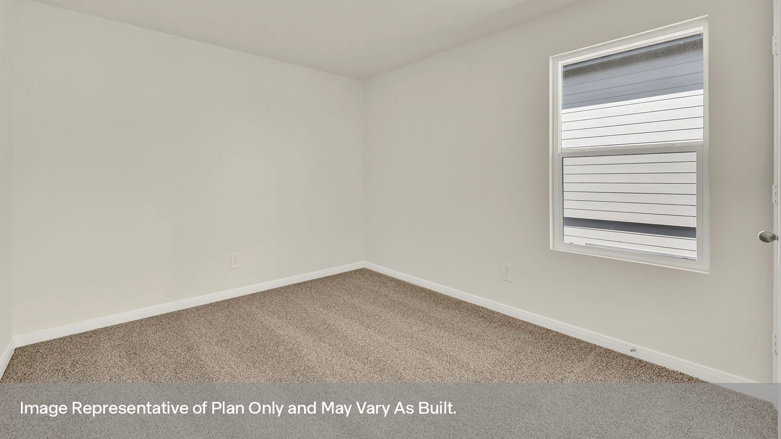 Bedroom with carpeting and one window.