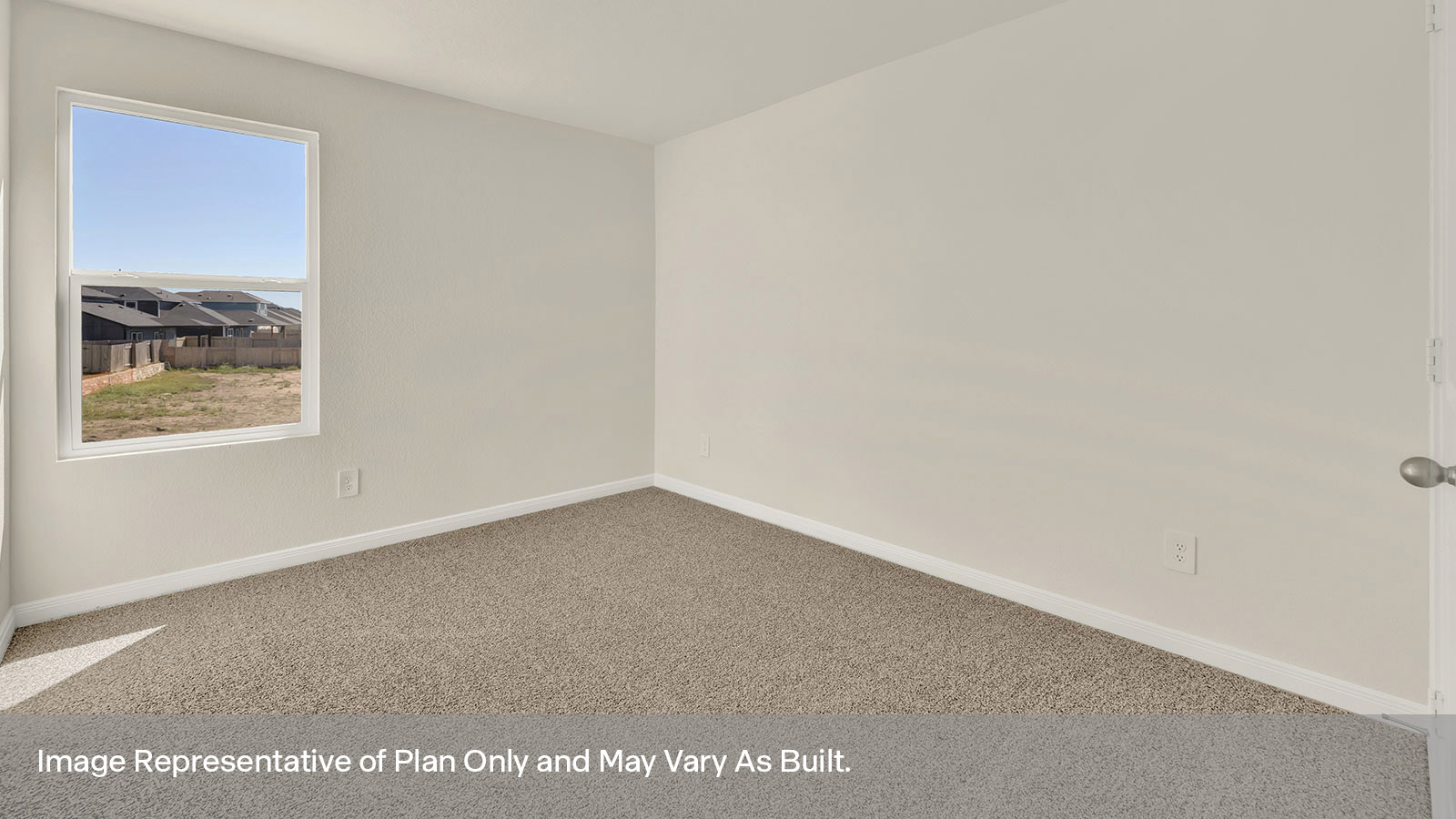 Bedroom with carpeting and one window.