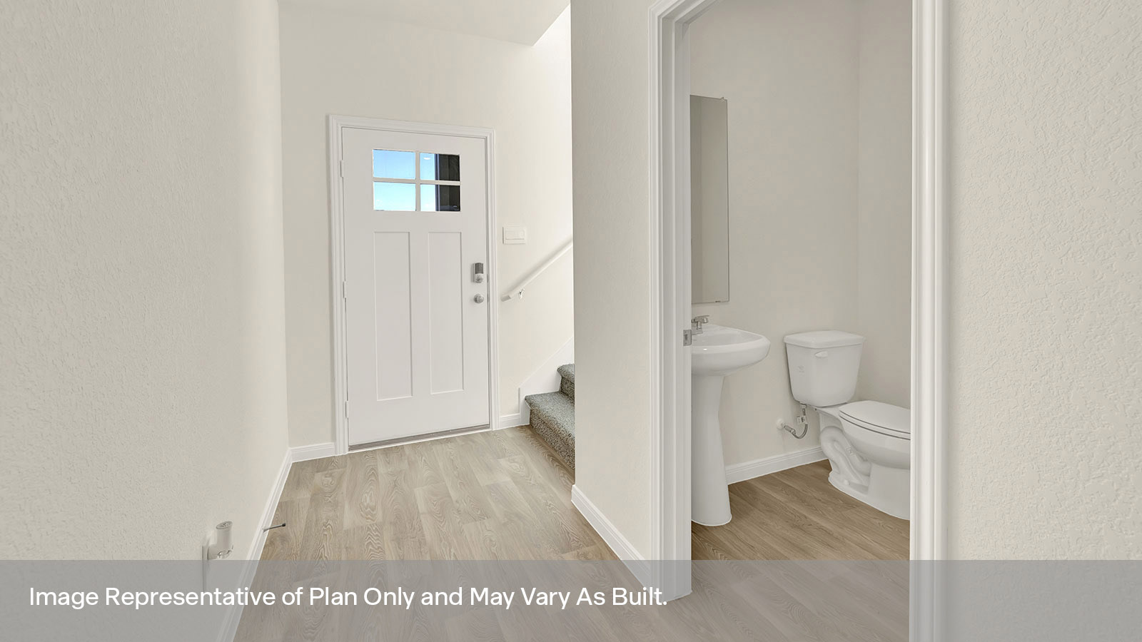 Entry hallway with vinyl flooring and front door.