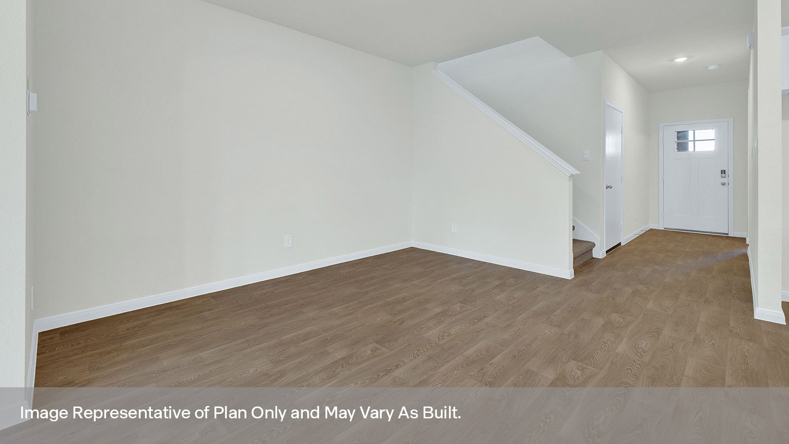 Dining room with vinyl flooring and two windows.