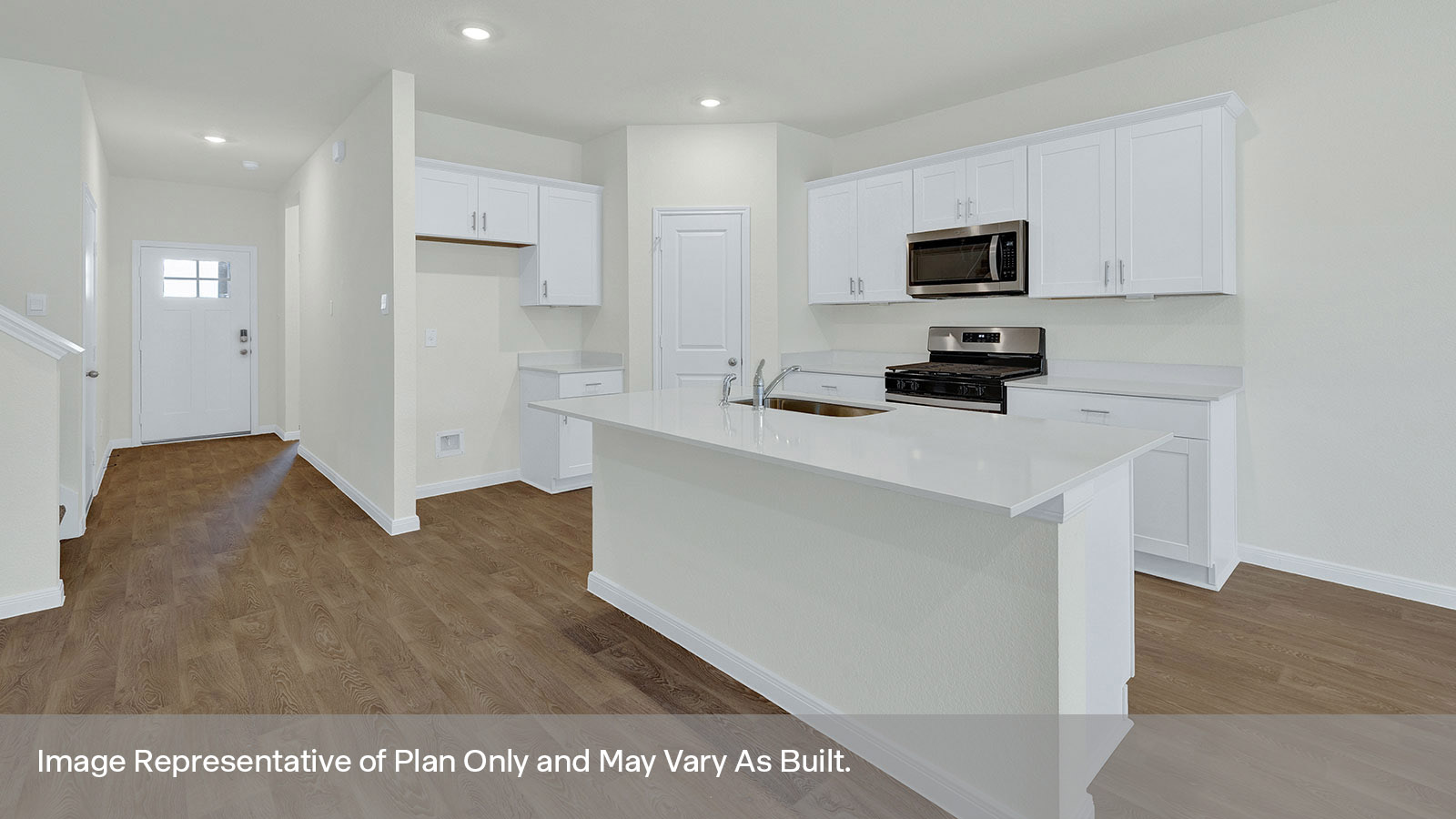 Kitchen with kitchen island and white cabinets.