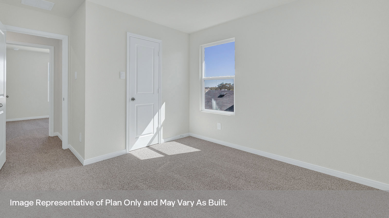 Bedroom with carpeting and one window.