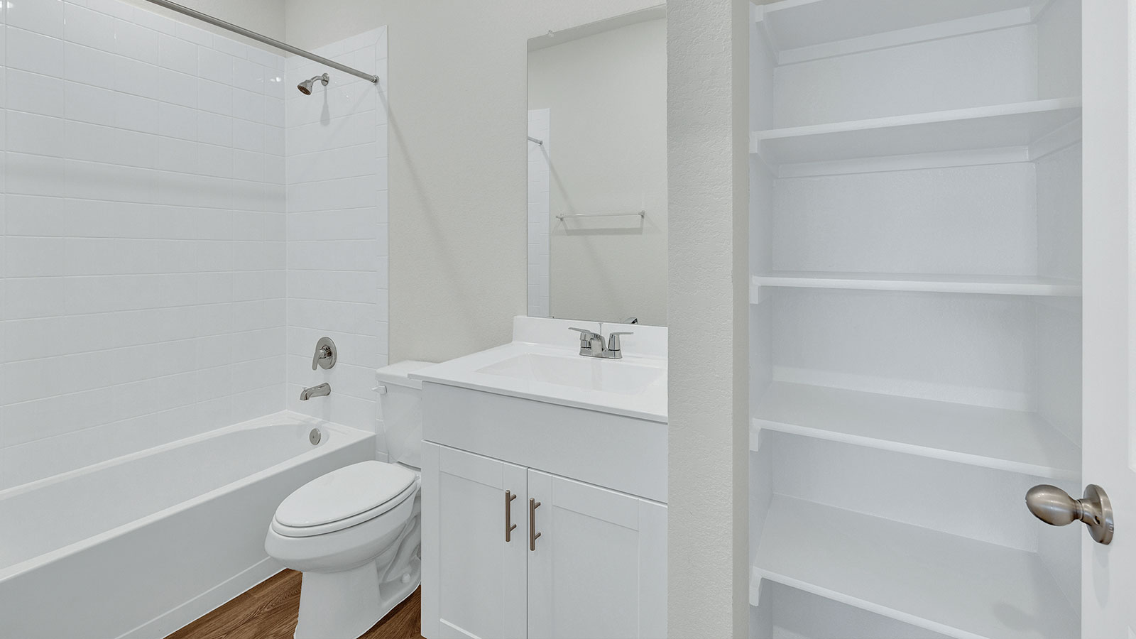 Hall bathroom with sink, toilet, and tub.