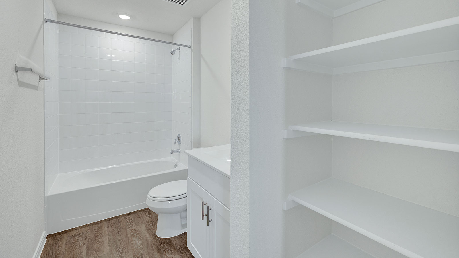 Third bathroom with sink, toilet, and tub.