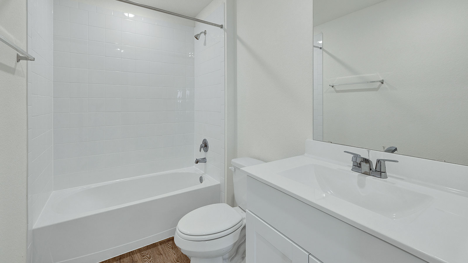 Third bathroom with sink, toilet, and tub.