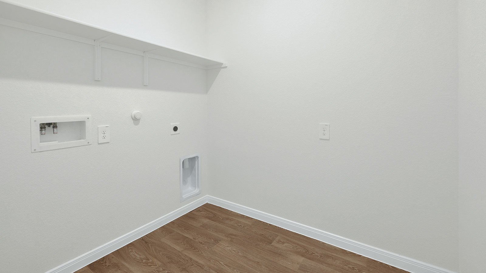 Laundry room with washer/dryer connections and wooden shelving.