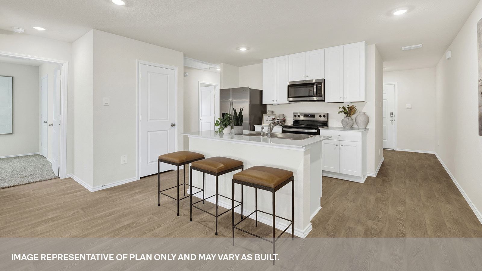 Kitchen with kitchen island and white cabinets.