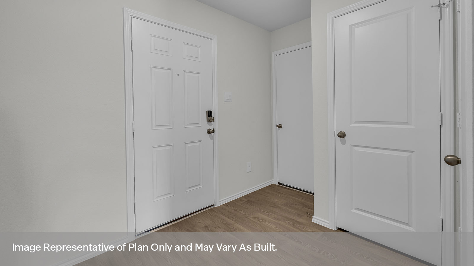 Entryway showing the door to the power room and garage