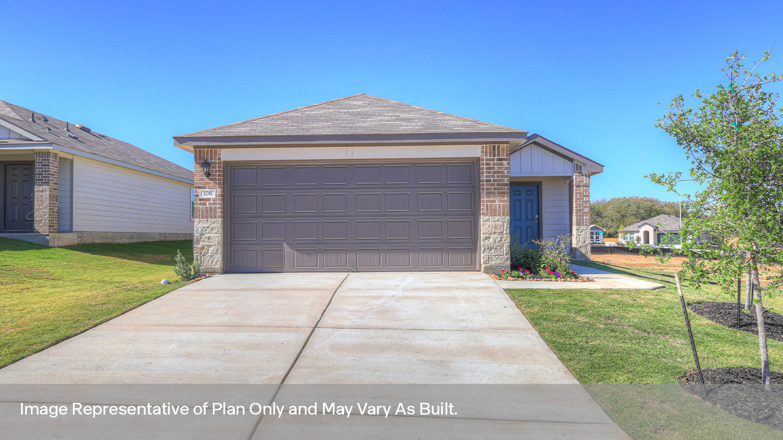 Single story home with a two car garage, siding exterior and a wrap around entry way