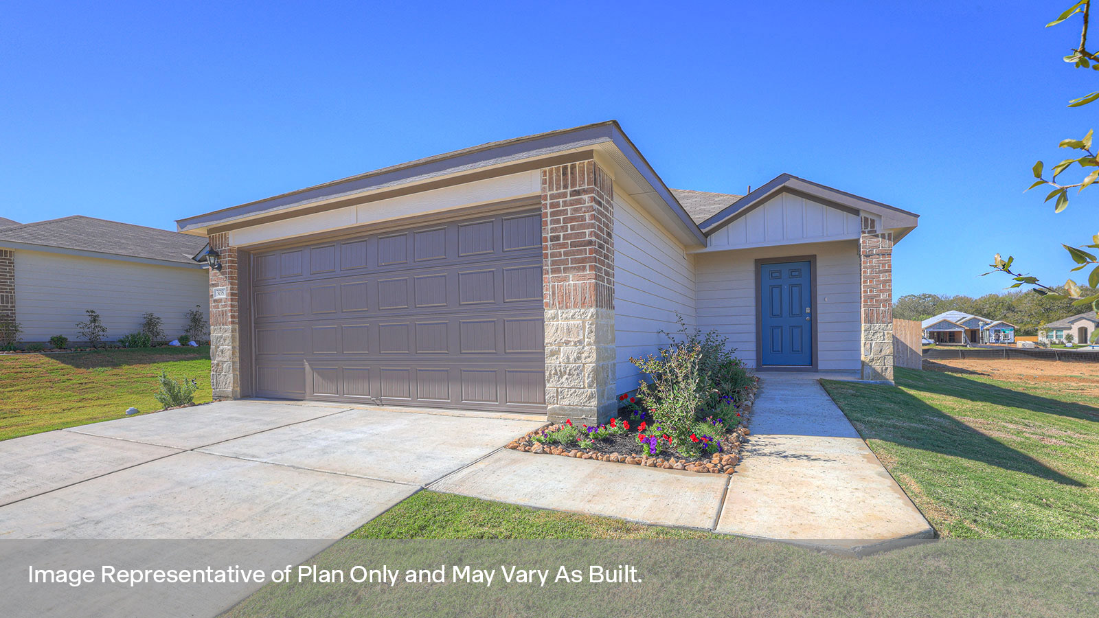 Single story home with a two car garage, siding exterior and a wrap around entry way