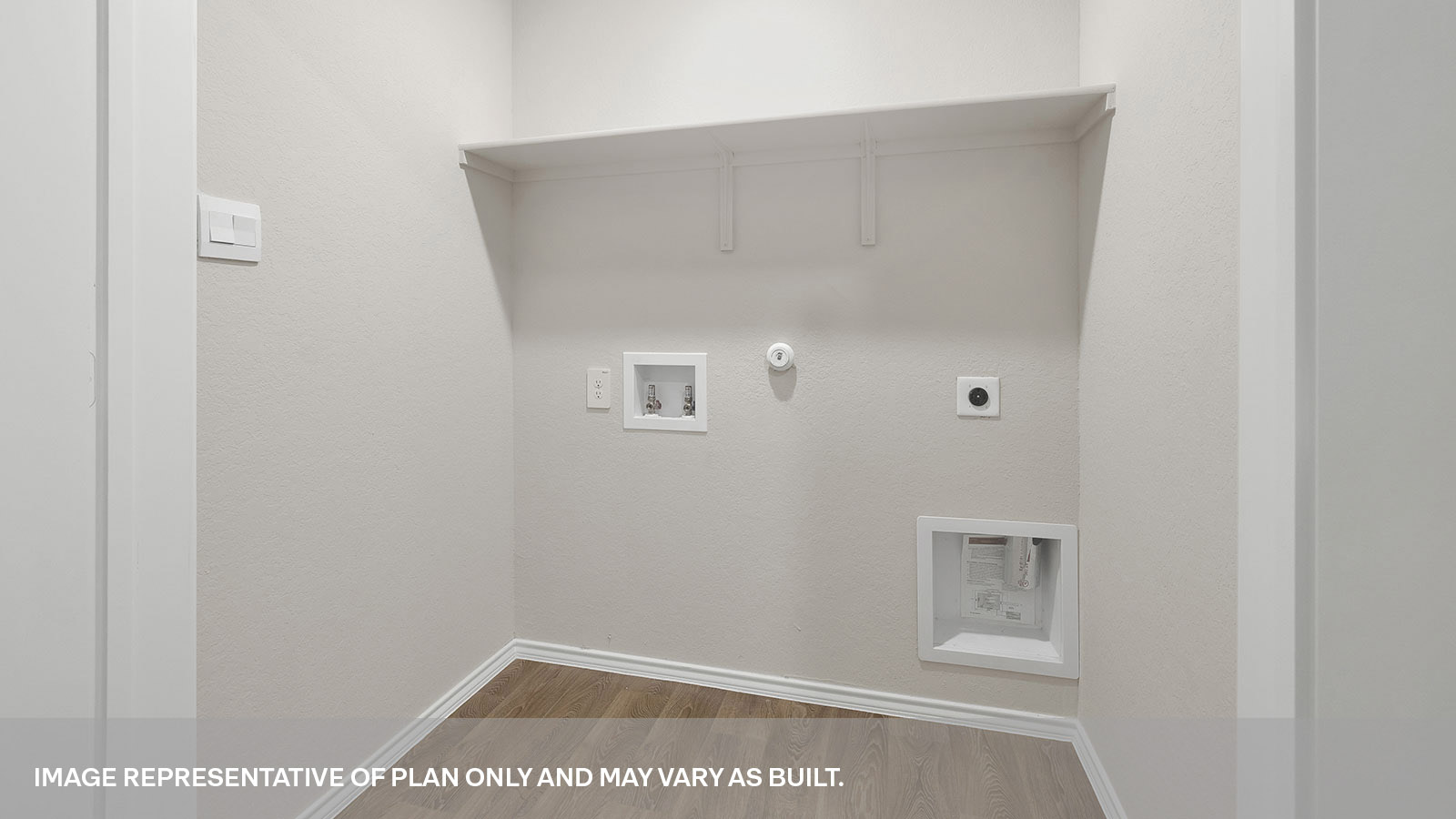 Laundry room with washer/dryer connections and wooden shelving.
