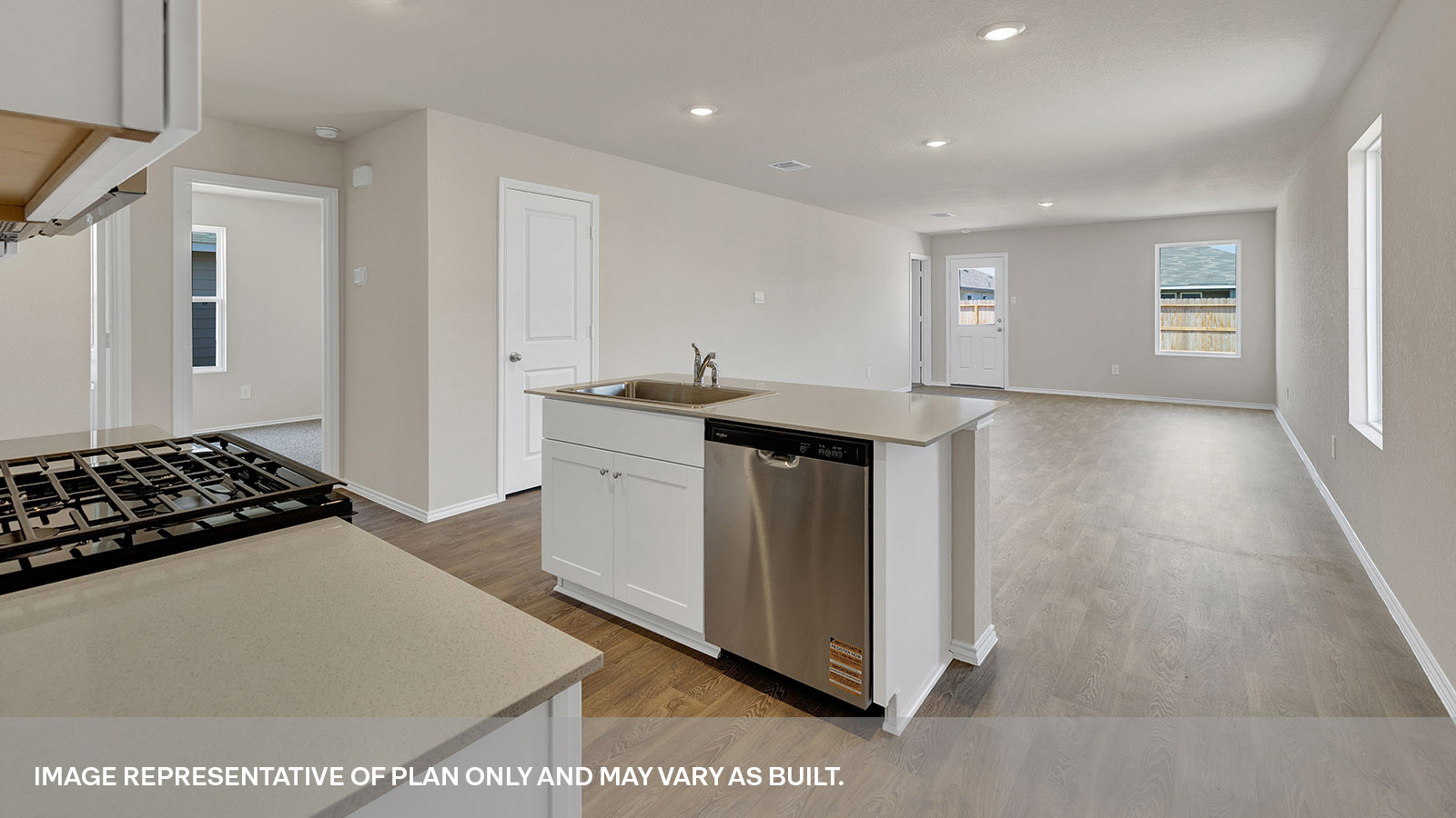 Kitchen with kitchen island and white cabinets.