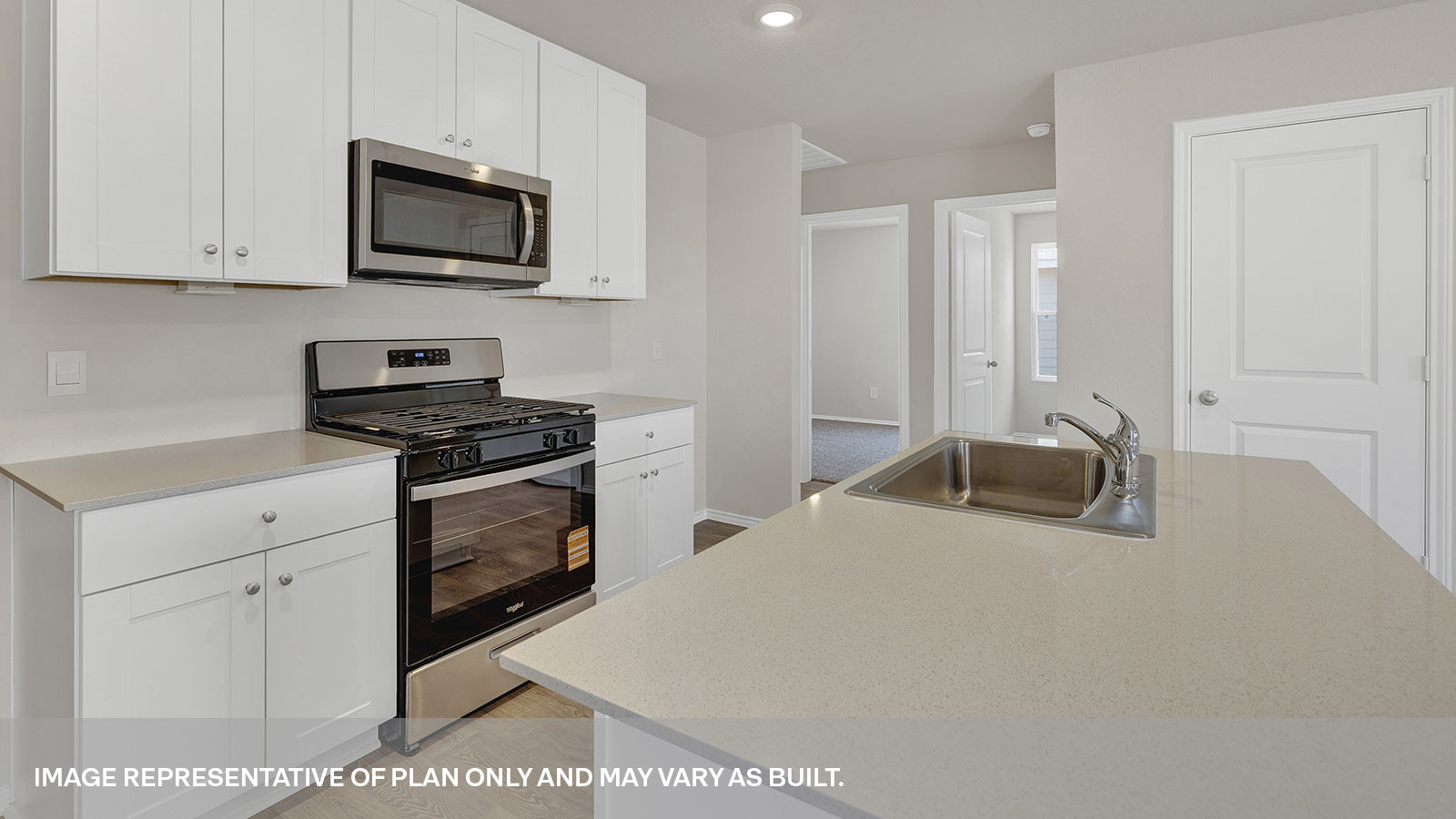 Kitchen with kitchen island and sink.