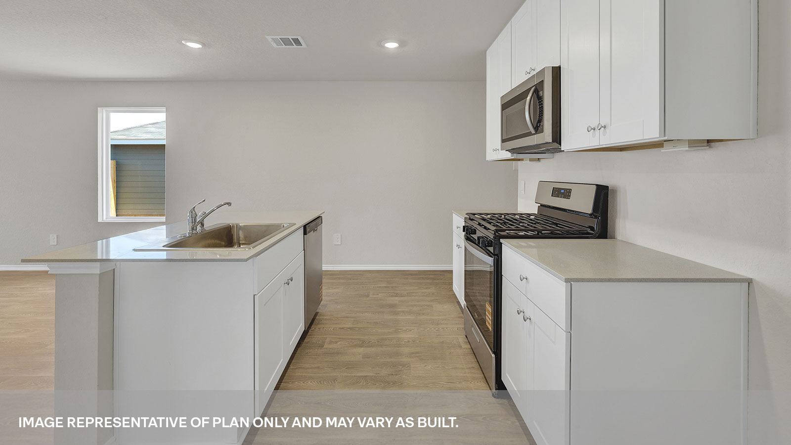 Kitchen with kitchen island and quartz countertops.
