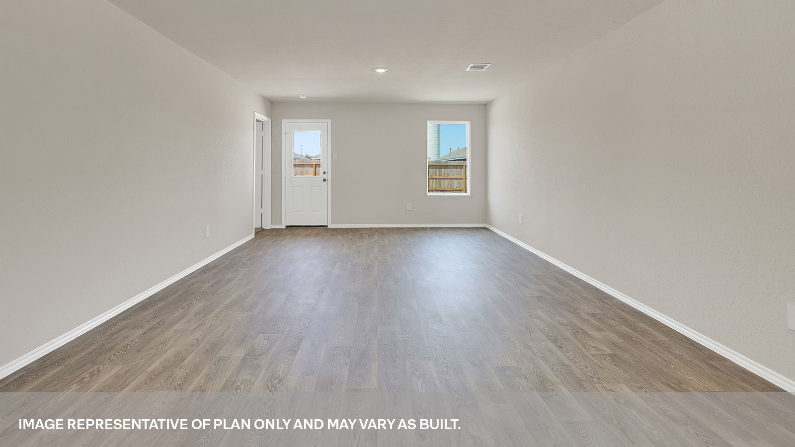 Living room with vinyl flooring, 2 windows, and  half lite exterior door.