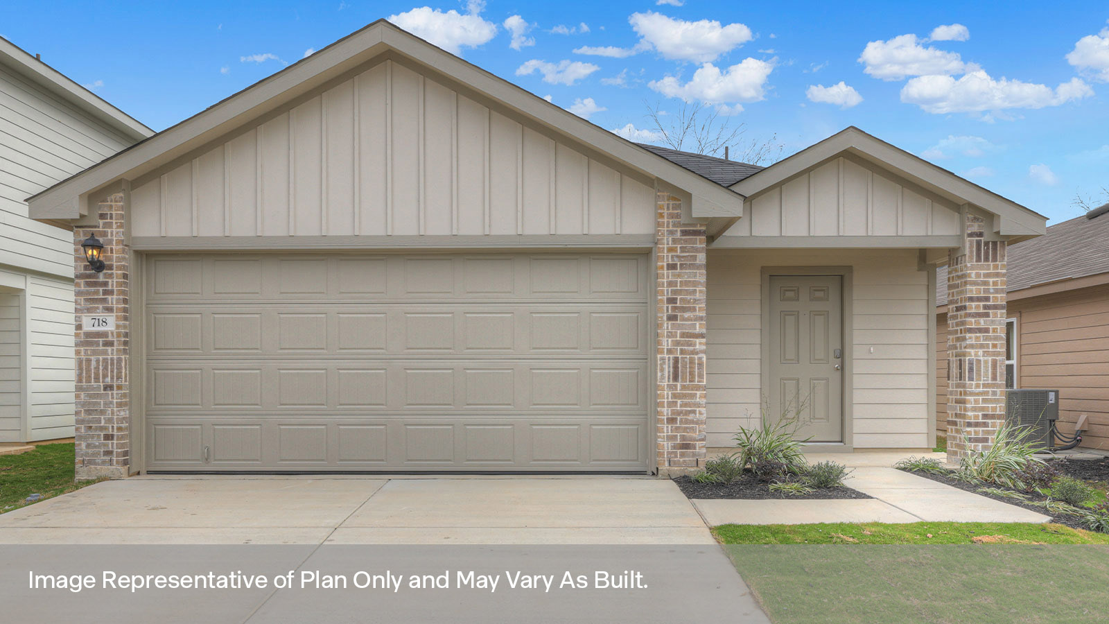 Siding Exterior with a two car garage and covered entry