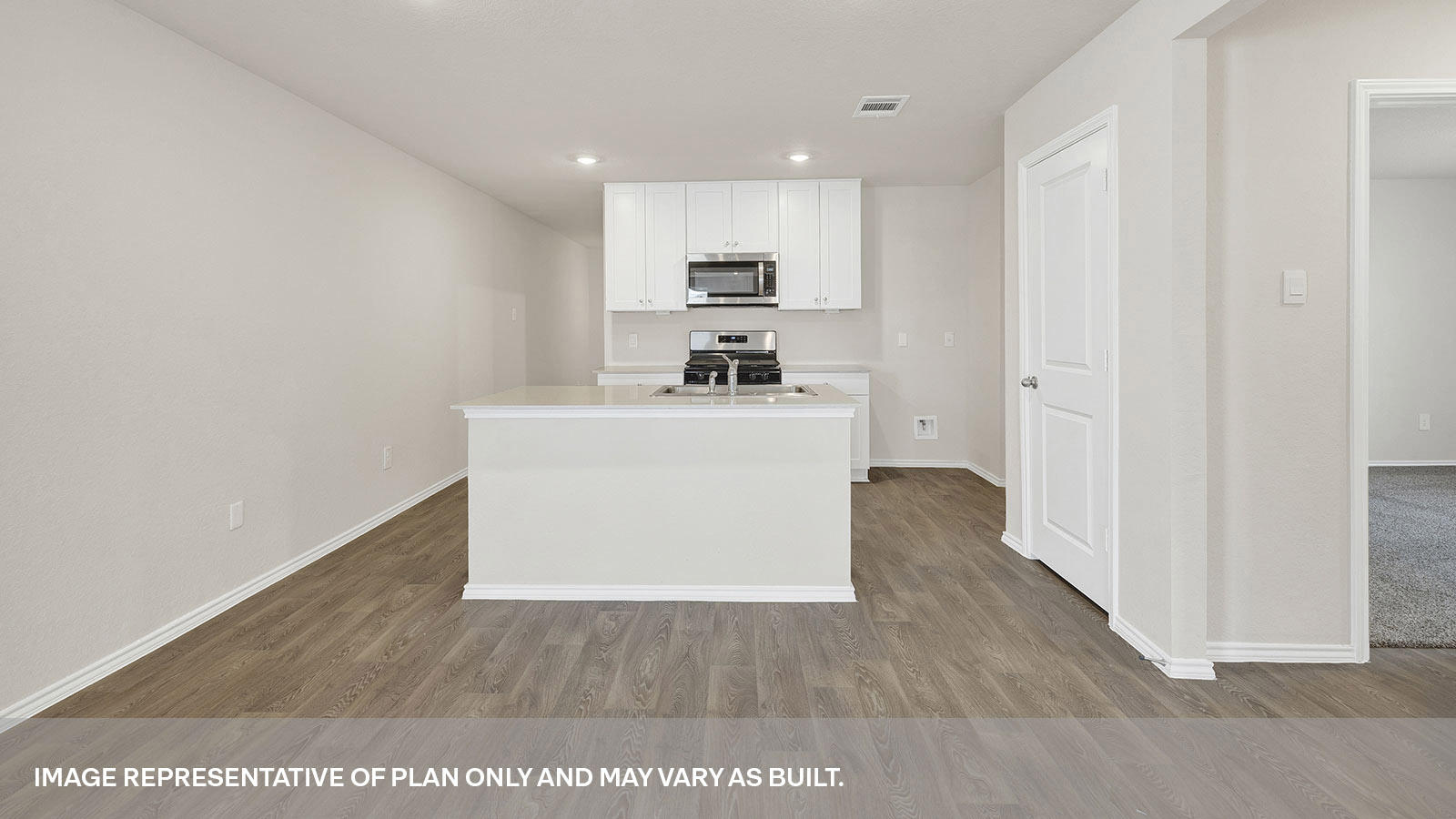 Kitchen with kitchen island and quartz countertops.