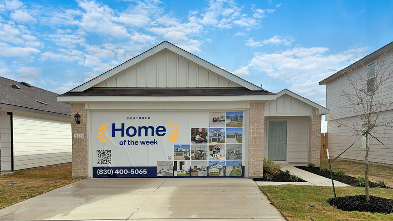 two car garage, siding and a wrap around sidewalk to the front entry