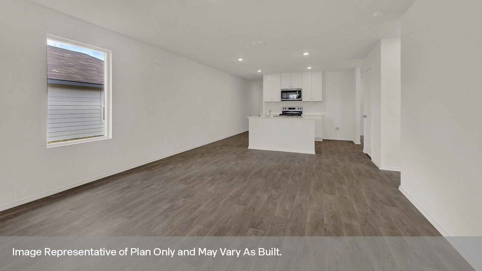 Dining room and living room featuring two windows and a door to the back yard