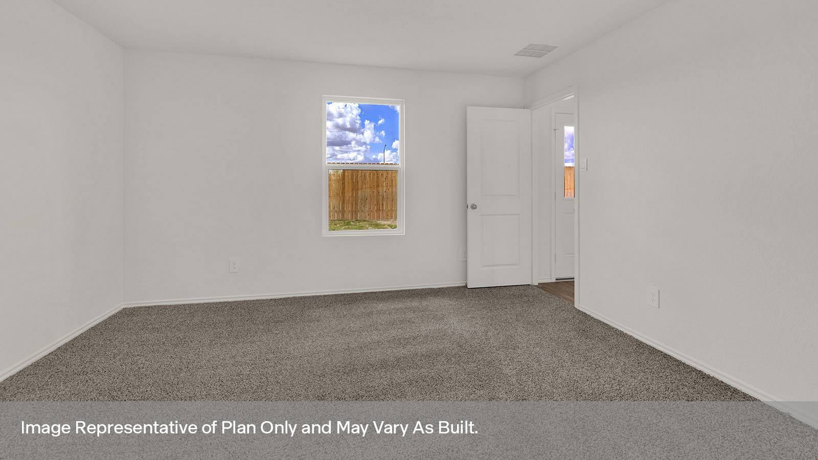 View from the living looking into the dining room and kitchen
