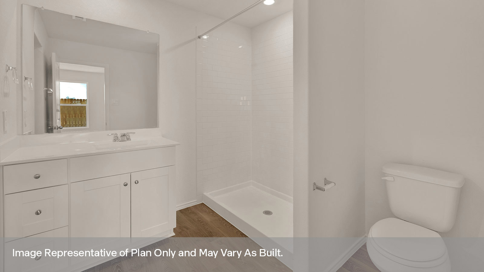 Primay bath with an extended vanity, toilet and walk in tile surround shower